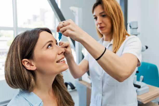 Ophthalmologist Using Eyedropper