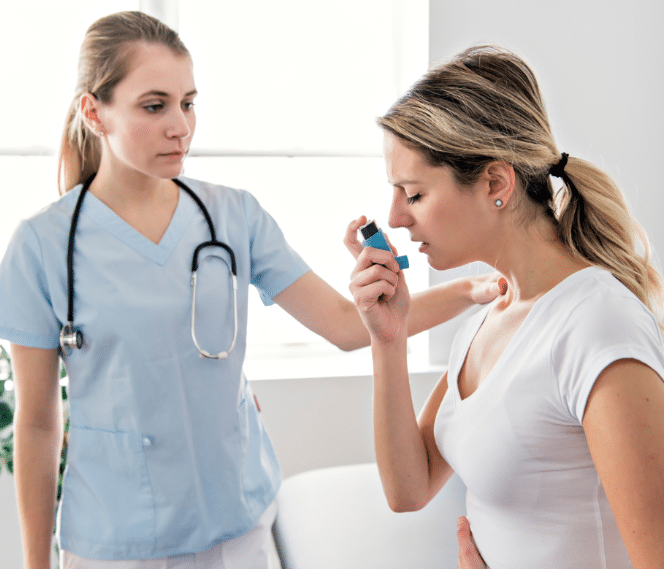 Doctor helping patient to take an inhaler 