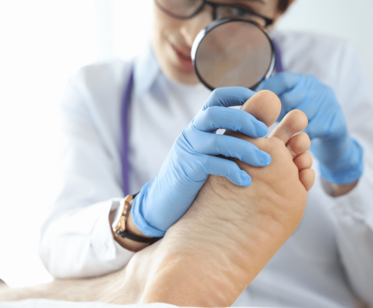 Doctor checking a toenail