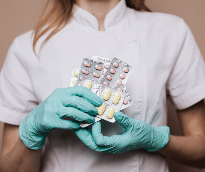 A nurse holding a medicine