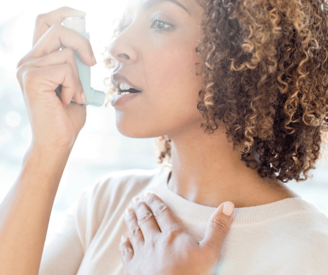 woman using an inhaler 