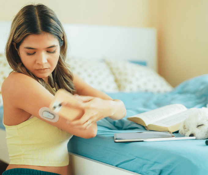 Woman using a glucose meter 