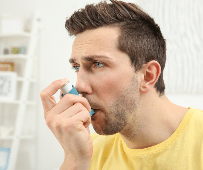 A man using fluvent inhaler