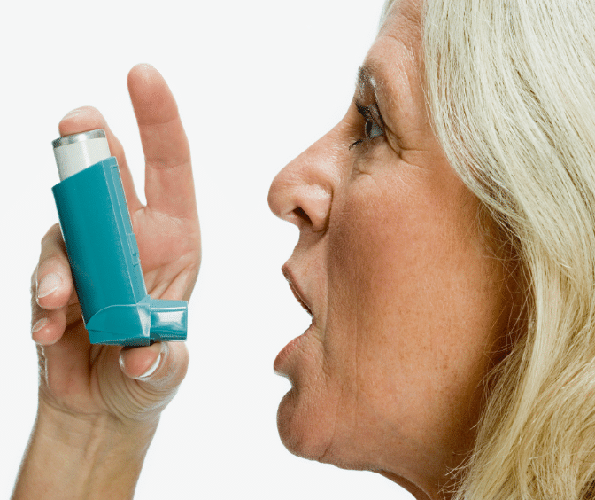 Old woman using Breo Ellipta inhaler
