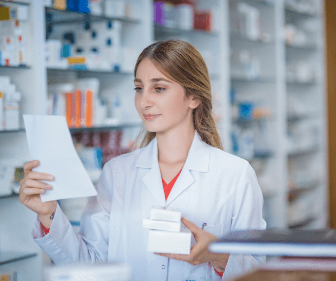 A pharmacist reading a prescription