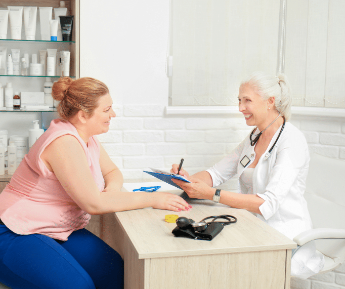 Obese woman consulting with her doctor 