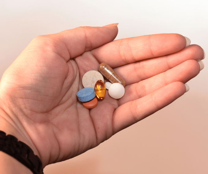 A hand holding medicines