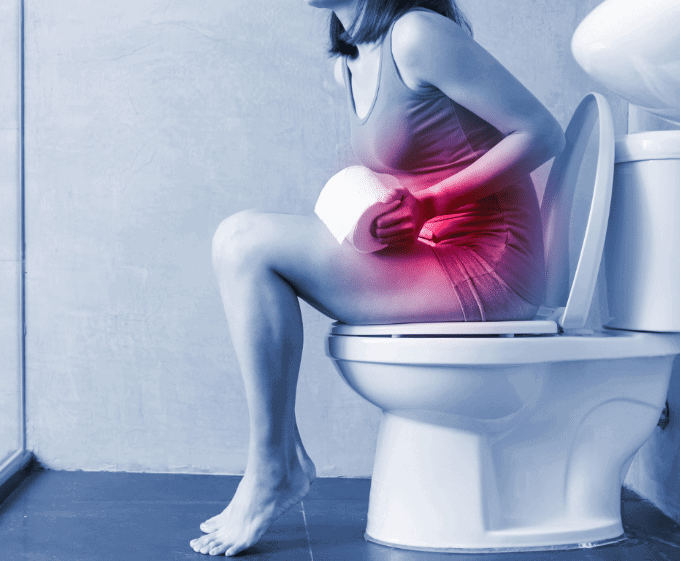 Woman having diarrhea